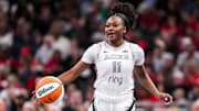 Las Vegas Aces guard Dana Evans (11) brings the ball up the court Thursday, July 3, 2025, during a game between the Indiana Fever and the Las Vegas Aces at Gainbridge Fieldhouse in Indianapolis.