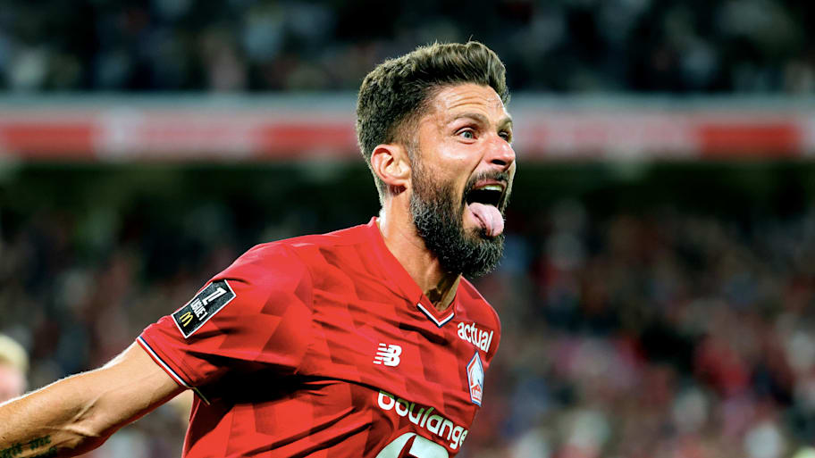 Lille striker Olivier Giroud celebrating.