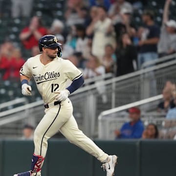 Minnesota Twins third baseman Kyle Farmer (12) looks back after hitting a three-run home run during the second inning against the Los Angeles Angels at Target Field in Minneapolis on Sept. 10, 2024. 