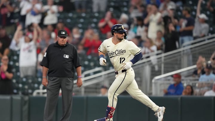 Minnesota Twins third baseman Kyle Farmer (12) looks back after hitting a three-run home run during the second inning against the Los Angeles Angels at Target Field in Minneapolis on Sept. 10, 2024. 