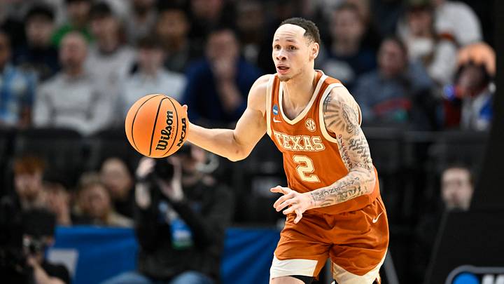 Mar 21, 2026; Portland, OR, USA; Texas Longhorns guard Chendall Weaver (2) dribbles in the first half against the Gonzaga Bulldogs during a second round game of the men's 2026 NCAA Tournament at Moda Center. Mandatory Credit: Craig Strobeck-Imagn Images