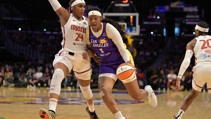 Jul 15, 2025; Los Angeles, California, USA; Washington Mystics forward Aaliyah Edwards (24) guards Los Angeles Sparks forward Sania Feagin (1) during the first half at Crypto.com Arena. Mandatory Credit: Jayne Kamin-Oncea-Imagn Images