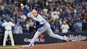 Oct 25, 2025; Toronto, Ontario, CAN; Los Angeles Dodgers pitcher Yoshinobu Yamamoto (18) throws a pitch against the Toronto Blue Jays in the ninth inning during game two of the 2025 MLB World Series at Rogers Centre. Mandatory Credit: Dan Hamilton-Imagn Images