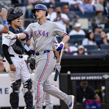 Aug 10, 2024; Bronx, New York, USA; Texas Rangers shortstop Corey Seager (5) is greeted at home plate by Texas Rangers outfielder Leody Taveras (3) after hitting a three run home run against the New York Yankees during the sixth inning at Yankee Stadium. Mandatory Credit: John Jones-USA TODAY Sports