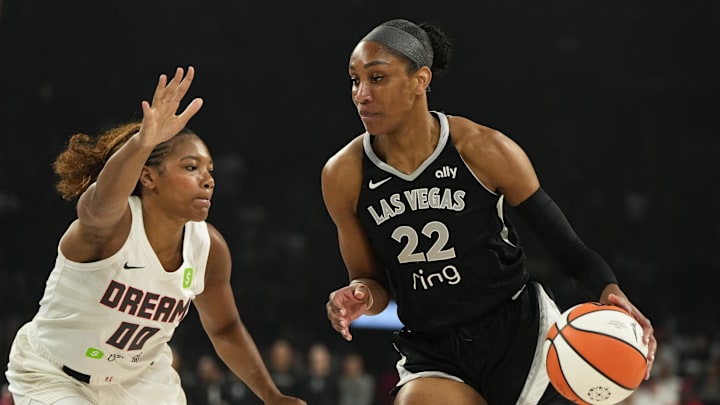 Aug 19, 2025; Las Vegas, Nevada, USA; Las Vegas Aces center A'ja Wilson (22) drives the ball past Atlanta Dream forward Naz Hillmon (00) during the first half of a WNBA basketball game at Michelob Ultra Arena. Mandatory Credit: Lucas Peltier-Imagn Images Aug 19, 2025; Las Vegas, Nevada, USA; Las Vegas Aces center A'ja Wilson (22) drives the ball past Atlanta Dream forward Naz Hillmon (00) during the first half of a WNBA basketball game at Michelob Ultra Arena. Mandatory Credit: Lucas Peltier-Imagn Images