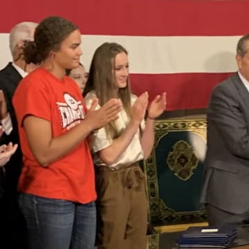 Husker athletes Rebekah Allick and Jordy Bahl (left) attend the signing of the "Stand with Women" Act at the Nebraska State Capitol.