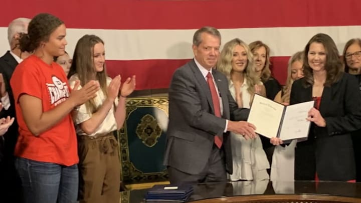 Husker athletes Rebekah Allick and Jordy Bahl (left) attend the signing of the "Stand with Women" Act at the Nebraska State Capitol. Husker athletes Rebekah Allick and Jordy Bahl (left) attend the signing of the "Stand with Women" Act at the Nebraska State Capitol.