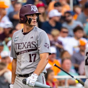 Jun 24, 2024; Omaha, NE, USA; Texas A&M Aggies right fielder Jace Laviolette (17) walks off as catcher Jackson Appel (20) walks up to bat during the sixth inning against the Tennessee Volunteers at Charles Schwab Field Omaha. Mandatory Credit: Dylan Widger-USA TODAY Sports