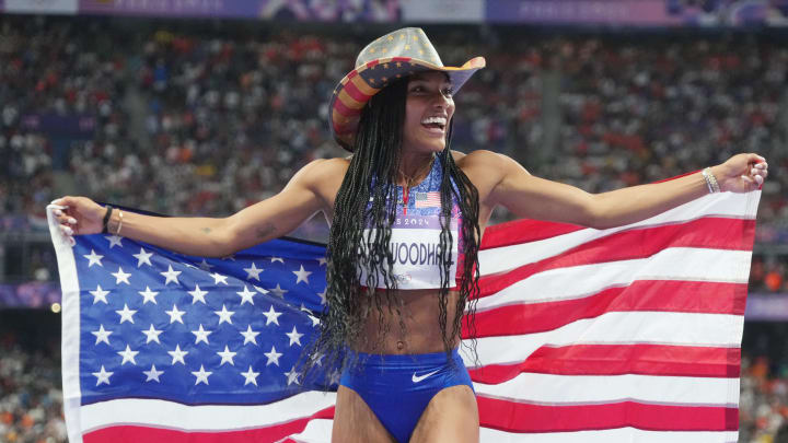 Aug 8, 2024: Tara Davis-Woodhall celebrates winning the women's long jump final during the Paris 2024 Olympic Summer Games at Stade de France. Mandatory Credit: Kirby Lee-USA TODAY Sports