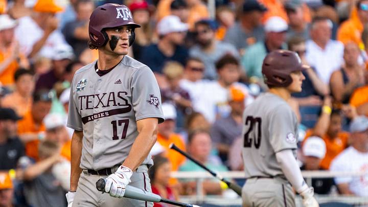 Jun 24, 2024: Texas A&M Aggies right fielder Jace Laviolette (17) walks off as catcher Jackson Appel (20) walks up to bat during the sixth inning against the Tennessee Volunteers at Charles Schwab Field Omaha. Credit: Dylan Widger-USA TODAY Sports
