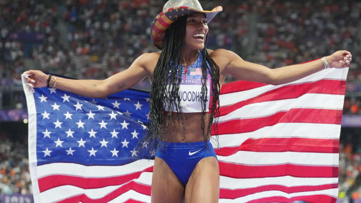 Aug 8, 2024; Saint-Denis, FRANCE; Tara Davis-Woodhall (USA) celebrates winning the women's long jump final during the Paris 2024 Olympic Summer Games at Stade de France. 