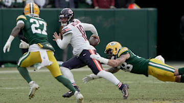 Chicago Bears quarterback Caleb Williams (18) avoids a sack during the fourth quarter of their game Sunday, January 5, 2025 at Lambeau Field in Green Bay, Wisconsin. The Chicago Bears beat the Green Bay Packers 24-22.
