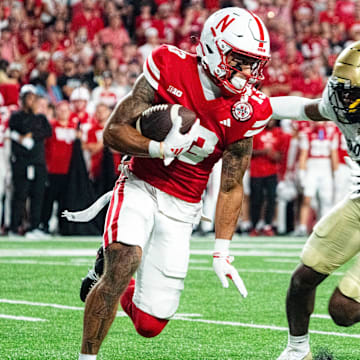 Sep 7, 2024; Lincoln, Nebraska, USA; Nebraska Cornhuskers wide receiver Isaiah Garcia-Castaneda (13) returns a punt against Colorado Buffaloes cornerback Colton Hood (3) during the third quarter at Memorial Stadium.