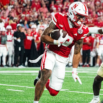 Sep 7, 2024; Lincoln, Nebraska, USA; Nebraska Cornhuskers wide receiver Isaiah Garcia-Castaneda (13) returns a punt against Colorado Buffaloes cornerback Colton Hood (3) during the third quarter at Memorial Stadium.