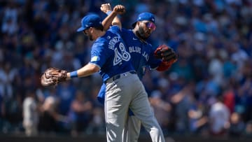 Vladimir Guerrero Jr. and Spencer Horwitz celebrate a Toronto Blue Jays win July 7 over the Seattle Mariners.