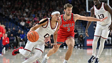 Feb 22, 2025; Spokane, Washington, USA; Gonzaga Bulldogs guard Ryan Nembhard (0) runs the lane abasing St. Mary's Gaels guard Augustas Marciulionis (3) in the second half at McCarthey Athletic Center. Mandatory Credit: James Snook-Imagn Images