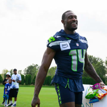 Jul 27, 2024; Renton, WA, USA; Seattle Seahawks wide receiver DK Metcalf (14) walks off the field after training camp at Virginia Mason Athletic Center. Mandatory Credit: Steven Bisig-USA TODAY Sports