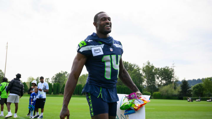 Jul 27, 2024; Renton, WA, USA; Seattle Seahawks wide receiver DK Metcalf (14) walks off the field after training camp at Virginia Mason Athletic Center. Mandatory Credit: Steven Bisig-USA TODAY Sports