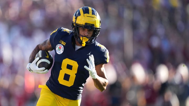 Jan 1, 2024; Pasadena, CA, USA; Michigan Wolverines wide receiver Tyler Morris (8) runs with the ball during the first half against the Alabama Crimson Tide in the 2024 Rose Bowl college football playoff semifinal game at Rose Bowl. Mandatory Credit: Kirby Lee-USA TODAY Sports