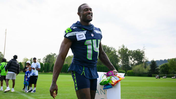 Jul 27, 2024; Renton, WA, USA; Seattle Seahawks wide receiver DK Metcalf (14) walks off the field after training camp at Virginia Mason Athletic Center. Mandatory Credit: Steven Bisig-Imagn Images