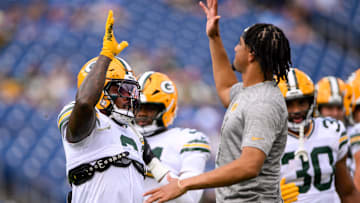 Sep 22, 2024; Nashville, Tennessee, USA;  Green Bay Packers quarterback Jordan Love (10) and running back Josh Jacobs (8) against the Tennessee Titans during pregame warmups at Nissan Stadium. Mandatory Credit: Steve Roberts-Imagn Images