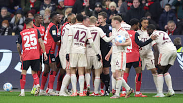 Bayern Munich players in action against Bayer Leverkusen.