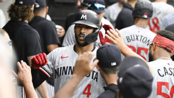 Jul 10, 2024; Chicago, Illinois, USA;  Minnesota Twins shortstop Carlos Correa (4) celebrates in the dugout after hitting a home run against the Chicago White Sox during the sixth inning at Guaranteed Rate Field. Mandatory Credit: Matt Marton-USA TODAY Sports