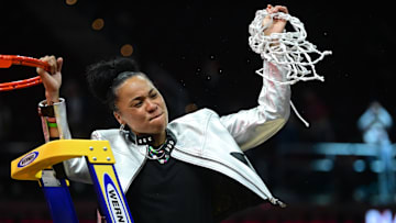 South Carolina basketball coach Dawn Staley after cutting down the nets following her third National Championship
