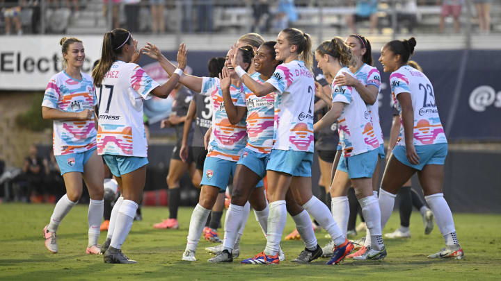 Jul 20, 2024; San Diego, CA, USA; San Diego Wave FC defender Kennedy Wesley (12) celebrates with teammates after scoring a goal against Bay FC in the first half at Torero Stadium. Mandatory Credit: Denis Poroy-USA TODAY Sports