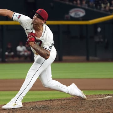 Jul 8, 2024; Phoenix, Arizona, USA; Arizona Diamondbacks pitcher Justin Martinez (63) throws against the Atlanta Braves in the eleventh inning at Chase Field. Mandatory Credit: Rick Scuteri-USA TODAY Sports