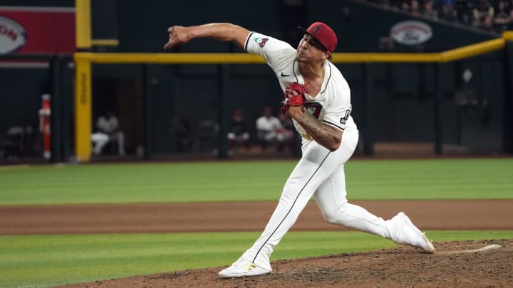 Jul 8, 2024; Phoenix, Arizona, USA; Arizona Diamondbacks pitcher Justin Martinez (63) throws against the Atlanta Braves in the eleventh inning at Chase Field. Mandatory Credit: Rick Scuteri-USA TODAY Sports