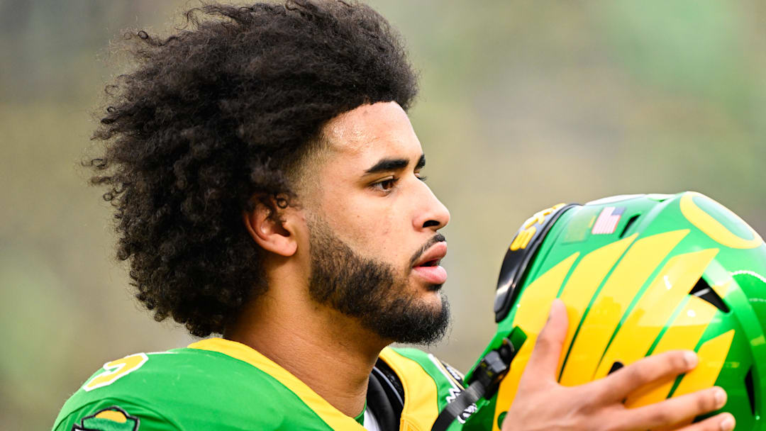 Dec 20, 2025; Eugene, OR, USA; Oregon Ducks quarterback Dante Moore (5) looks on before the game against the James Madison Dukes at Autzen Stadium. Mandatory Credit: Troy Wayrynen-Imagn Images