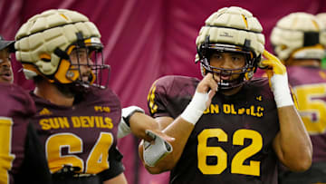 Arizona State offensive linemen Wade Helton (64) and Ben Coleman (62) run a drill during a practice inside the Verde Dickey Dome in Tempe on August 12, 2025.