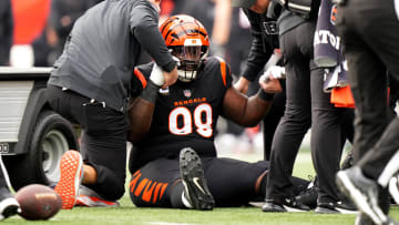 Cincinnati Bengals defensive tackle DJ Reader (98) is helped up after suffering an injury in the first quarter of a Week 15 NFL football game between the Minnesota Vikings and the Cincinnati Bengals, Saturday, Dec. 16, 2023, at Paycor Stadium in Cincinnati.