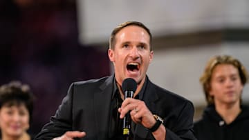 Oct 17, 2024; New Orleans, Louisiana, USA; New Orleans Saints retired quarterback Drew Brees (9) reacts during his hall of fame ceremony at halftime against the Denver Broncos at Caesars Superdome. Mandatory Credit: Matthew Hinton-Imagn Images