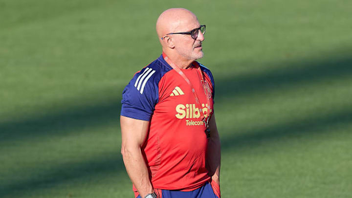 Luis de la Fuente, the head coach of Spain looks on during...