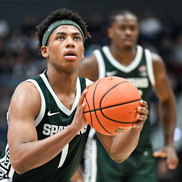 Michigan State is a home favorite against Arkansas in Saturday's college basketball slate.