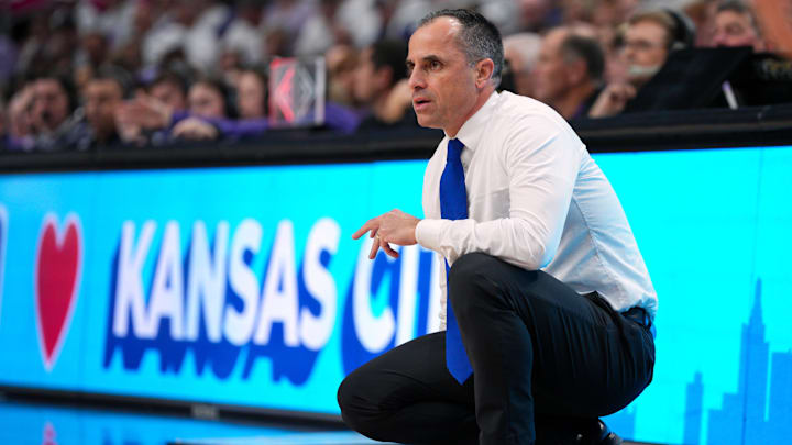 Dec 17, 2024; Kansas City, Missouri, USA; Drake Bulldogs head coach Ben McCollum watches the action during the first half against the Kansas State Wildcats at T-Mobile Center. Mandatory Credit: Jay Biggerstaff-Imagn Images