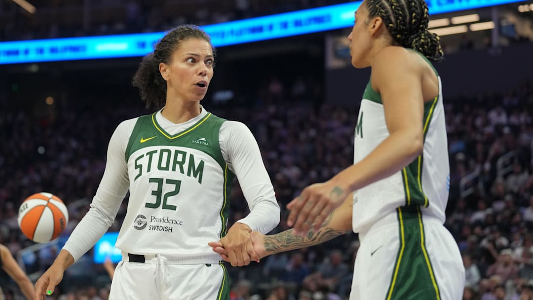 Jun 29, 2025; San Francisco, California, USA; Seattle Storm forward Alysha Clark (32) talks with forward Gabby Williams (right) during the first quarter against the Golden State Valkyries at Chase Center. Mandatory Credit: Darren Yamashita-Imagn Images