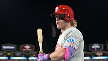 Sep 16, 2025; Los Angeles, California, USA;  Philadelphia Phillies center fielder Harrison Bader (2) gets ready in the dugout against the Los Angeles Dodgers at Dodger Stadium. Mandatory Credit: Jayne Kamin-Oncea-Imagn Images