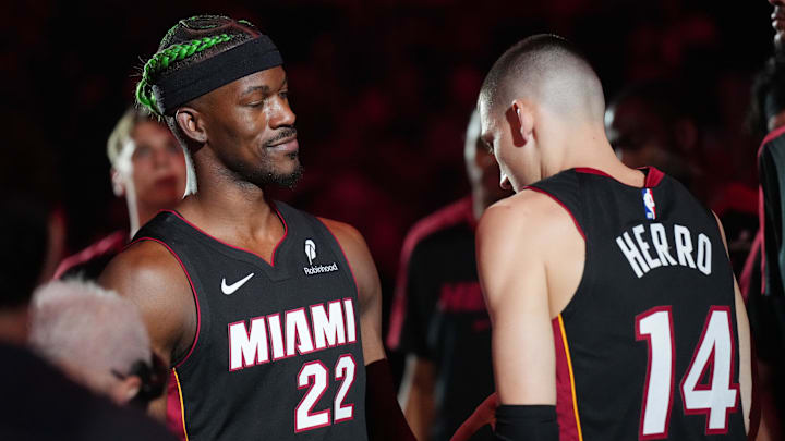 Jan 2, 2025; Miami, Florida, USA;  Miami Heat forward Jimmy Butler (22) and guard Tyler Herro (14) are introduced during pregame ceremonies before the game against the Indiana Pacers at Kaseya Center. Mandatory Credit: Jim Rassol-Imagn Images