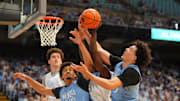 Oct 4, 2025; Charlotte, NC, USA; North Carolina Tar Heels guard Seth Trimble (7) and forward Caleb Wilson (8) and forward Zayden High (1) fight for the ball in the first half at Dean E. Smith Center. Mandatory Credit: Bob Donnan-Imagn Images