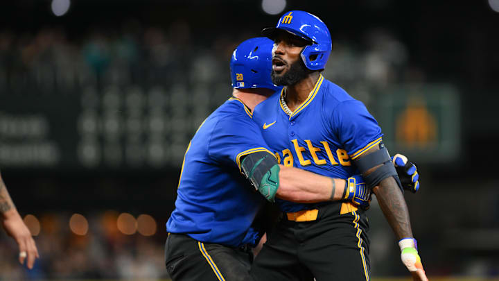 Seattle Mariners left fielder Luke Raley (left) and designated hitter Randy Arozarena (right) celebrate after Arozarena's walk off single against the Texas Rangers on Saturday at T-Mobile Park.