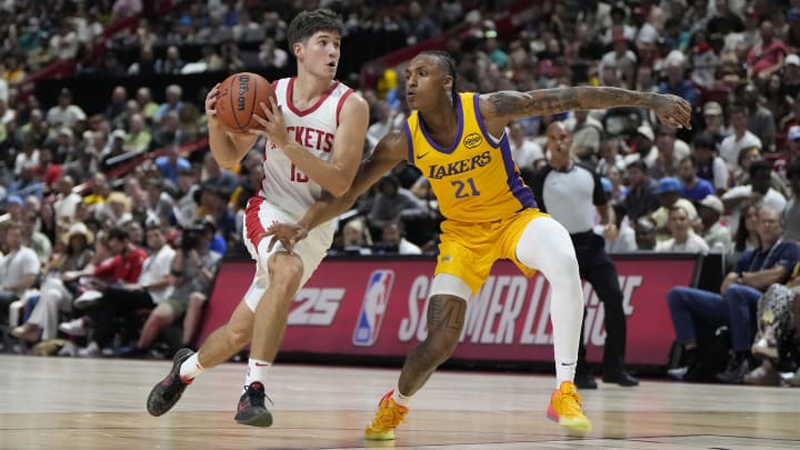  Houston Rockets guard Reed Sheppard (15) drives past Los Angeles Lakers forward Maxwell Lewis (21) on Friday in Las Vegas.