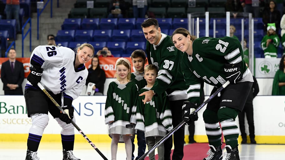 Minnesota forward Kendall Coyne and Boston forward Hilary Knight.