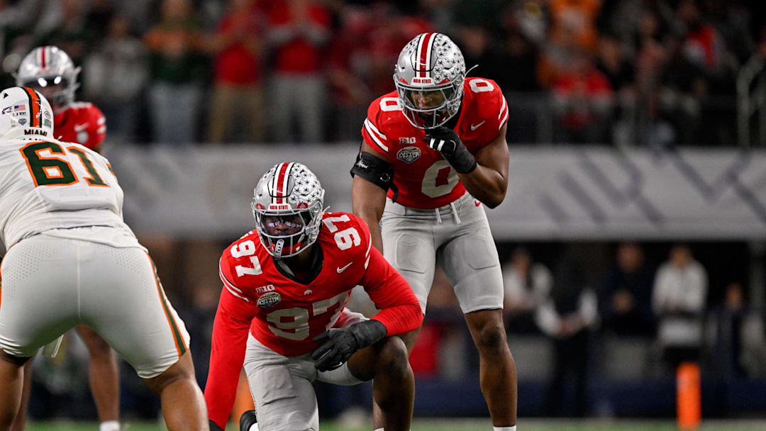 Dec 31, 2025; Arlington, TX, USA; Ohio State Buckeyes defensive end Kenyatta Jackson Jr. (97) and linebacker Sonny Styles (0) get into position during the 2025 Cotton Bowl and quarterfinal game of the College Football Playoff at AT&T Stadium. Mandatory Credit: Jerome Miron-Imagn Images