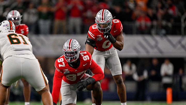 Dec 31, 2025; Arlington, TX, USA; Ohio State Buckeyes defensive end Kenyatta Jackson Jr. (97) and linebacker Sonny Styles (0) get into position during the 2025 Cotton Bowl and quarterfinal game of the College Football Playoff at AT&T Stadium. Mandatory Credit: Jerome Miron-Imagn Images