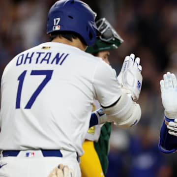 May 14, 2025; Los Angeles, California, USA; Los Angeles Dodgers second baseman Hyeseong Kim (6) celebrates with designated hitter Shohei Ohtani (17) after hitting a home run during the fifth inning against the Athletics at Dodger Stadium. Mandatory Credit: Jason Parkhurst-Imagn Images