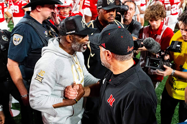 Coaches Deion Sanders of Colorado and Matt Rhule of Nebraska shake hands after the Huskers' 2024 over the Buffaloes.