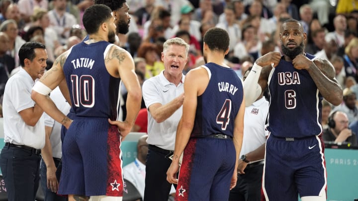 United States head coach Steve Kerr talks to centre Joel Embiid (11) and small forward Jayson Tatum (10) and shooting guard Stephen Curry (4) and guard LeBron James (6) in the first half against Brazil in a men’s basketball quarterfinal game during the Paris 2024 Olympic Summer Games at Accor Arena.